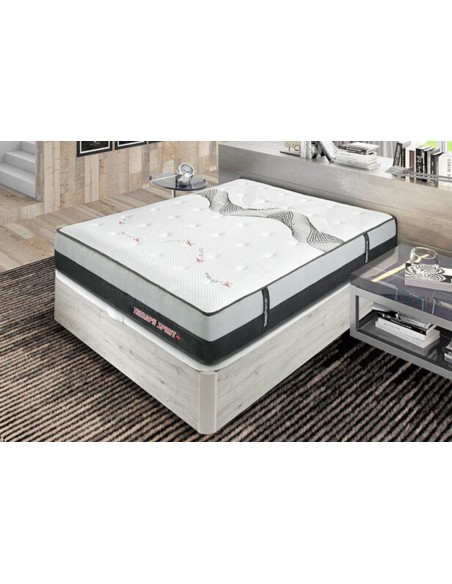 Colchón Therapy Sport blanco y gris con base tapizada en cama moderna, vista frontal