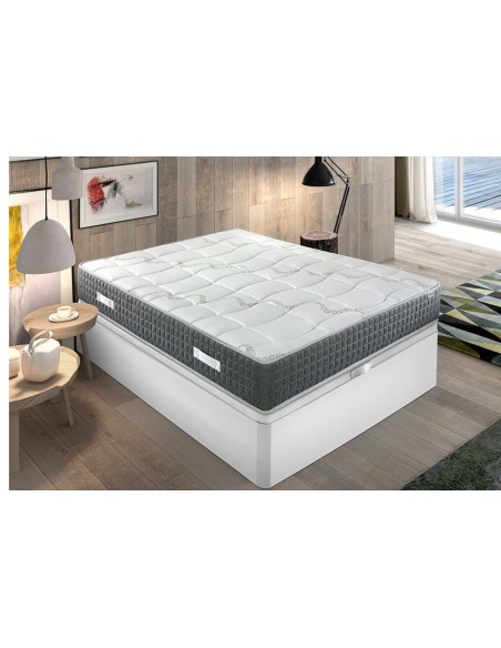 Colchón IDENTITY viscoelástico gris y blanco en cama tapizada, dormitorio moderno